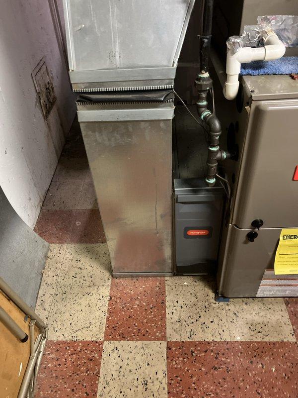 Conducted comprehensive assessment of existing HVAC system located in basement mechanical room for replacement estimate. Evaluated current furnace unit, air handler, ductwork configuration, electrical panel capacity, and condensate drainage system. Documented equipment specifications, installation conditions, and accessibility factors. Photographed existing system components including furnace with identification tags, ductwork assembly, PVC condensate lines, and electrical service panel to support replacement proposal. Previously ordered door switch and rollout switches are available for pickup from parts house pending installation scheduling.