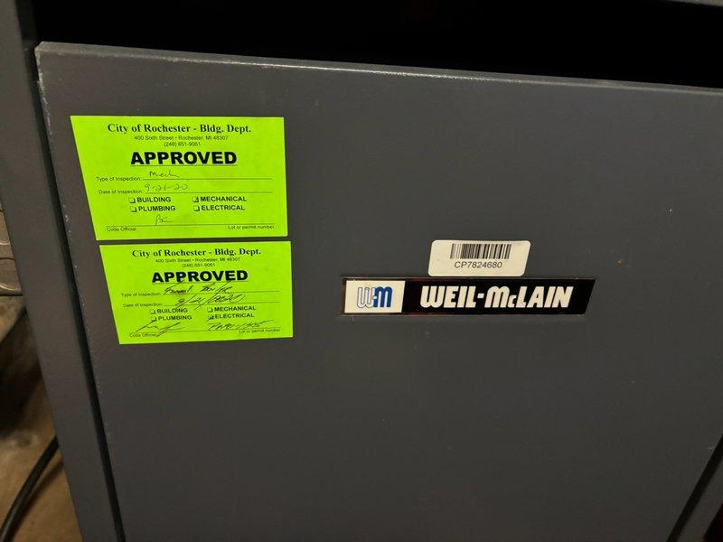 Responded to emergency call for Weil-McLain steam boiler actively leaking water in basement. Upon inspection, identified failed water feeder valve (VXT unit) with corroded brass fittings and union connections showing significant oxidation and deterioration. Shut down boiler system and replaced defective water feeder valve assembly, including associated corroded brass fittings and unions. Tested system for proper operation and verified no active leaks present. System restored to normal operation with all components functioning correctly.