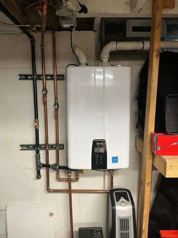 Completed comprehensive Gold Furnace Inspection on 2022 forced air heating system located in basement. Verified thermostat operation with Honeywell Home digital unit maintaining proper setpoint at 75°F with system actively heating. Performed multi-point inspection per gold service protocol including visual examination of furnace components, safety controls, and heat exchanger. Confirmed equipment operational status and documented system configuration with utility area containing tankless water heater and associated mechanical systems. All safety checks passed, certification requirements met, and unit found to be functioning within normal parameters for age and application.