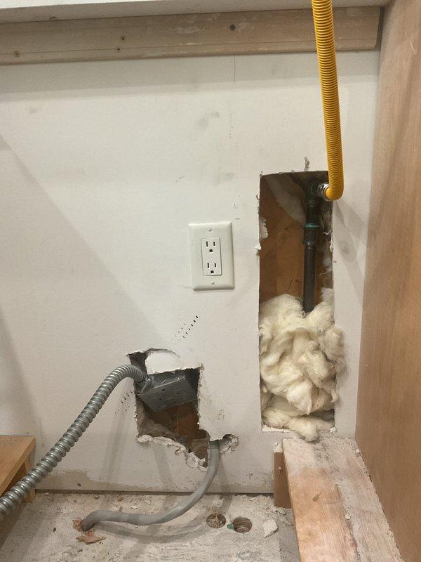 Completed gas line installation for cooking appliance per approved estimate. Ran new gas supply line through interior wall cavity utilizing appropriate flexible conduit and connections. Line has been pressure tested and is ready for final appliance hookup. During installation, identified that existing gas pressure regulator requires modification to allow oven unit to sit flush against wall as intended. Wall access openings created to facilitate proper routing of gas line from supply source to appliance location. All rough-in work completed with line terminated and capped at appliance connection point. Return visit scheduled to adjust regulator configuration and complete final appliance connection and commissioning.
