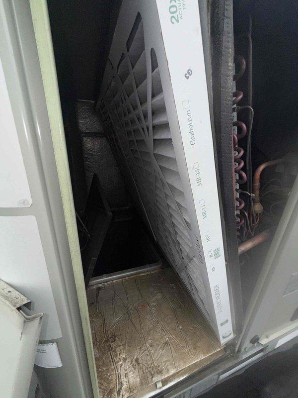 Performed scheduled filter change on commercial rooftop unit. Accessed RTU via roof, removed existing air filter from air handling compartment, and installed new pleated filter with proper orientation within metal housing. Verified filter fit and secure placement within ductwork system, ensured all access panels were properly closed, and confirmed unit operation upon completion.