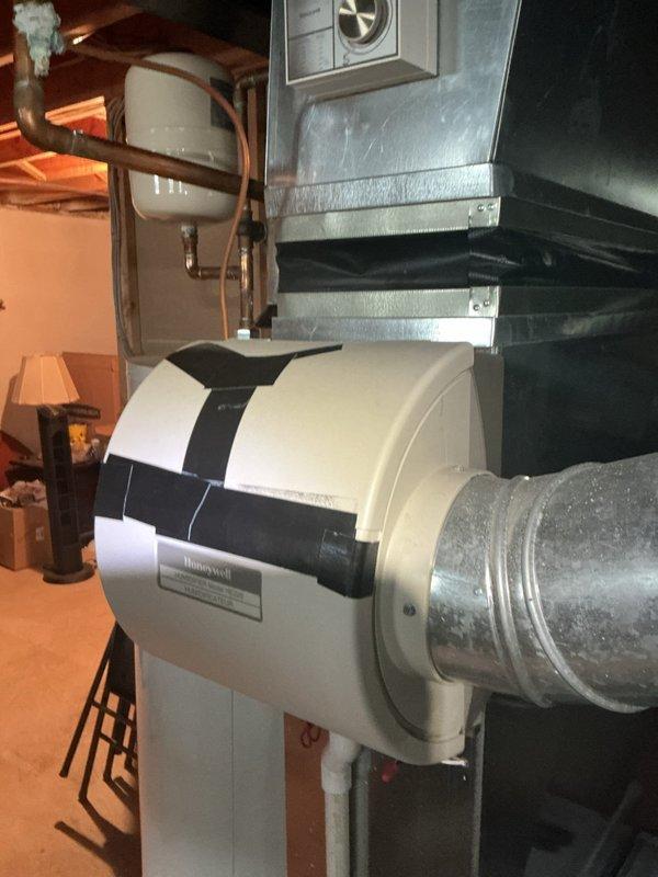 Completed comprehensive tune-up and inspection on 17-year-old Bryant furnace system located in basement as part of complimentary Gold maintenance plan visit. Performed thorough cleaning of burner assembly, heat exchanger inspection, blower motor lubrication, and combustion analysis to ensure optimal efficiency and safe operation. Inspected Honeywell humidifier unit mounted to supply ductwork and verified proper operation and water supply connections. Observed corrosion and mineral deposits on copper plumbing connections near expansion tank, documented condition with photos for customer awareness. Checked all electrical connections, tested ignition sequence, verified proper flame sensor operation, and confirmed adequate airflow throughout system. Filter replaced, thermostat operation verified, and all safety controls tested within manufacturer specifications. System operating safely with no immediate concerns; recommend monitoring copper piping corrosion for potential future service nee