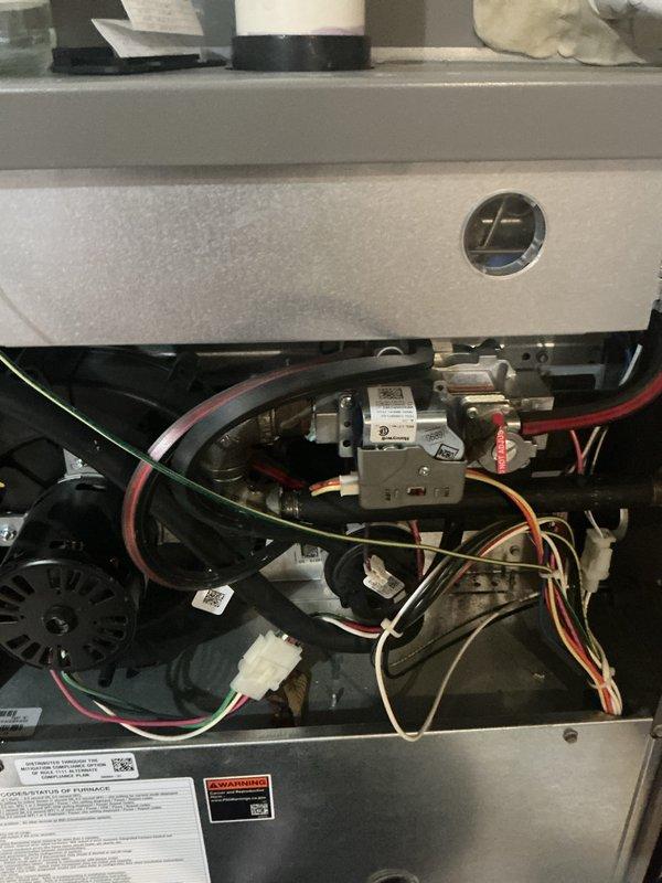 Completed furnace inspections on three units at a multi-unit residential property, including two systems located in the basement and one on the second floor. All units are 2019 models in operational condition. Performed standard tune-up procedures including visual inspection of gas valve assemblies, electrical connections, blower motors, and wiring harnesses; verified proper component operation and documented equipment condition with photographs showing internal components and control systems.