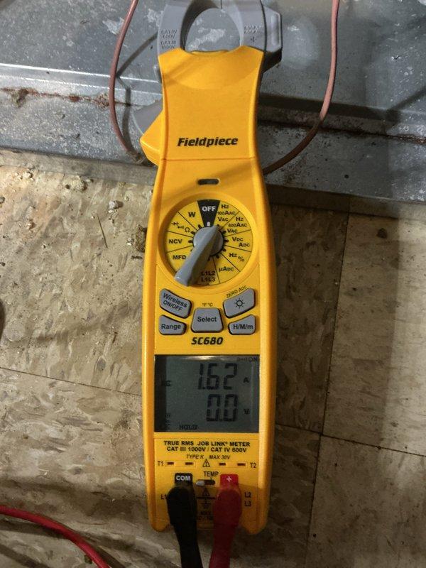 Responded to service call for gurgling noise coming from 2017 forced air furnace located in basement. Performed comprehensive inspection of heating system following previous repairs. Utilized Fieldpiece SC680 true RMS clamp meter to verify electrical readings and system performance. Measured incoming line voltage at 239 VAC, confirming proper power supply to unit. Tested amperage draw on system components, recording 10.2 amps during operation, which falls within normal operating parameters for equipment of this age and type. Inspected all accessible ductwork, condensate drainage system, and heat exchanger for potential sources of unusual sounds. Checked for proper condensate trap water level and drainage flow, as gurgling noises commonly originate from condensate system issues. Verified all electrical connections were secure and properly terminated. System operational at time of departure with no abnormal sounds detected during testing cycle.