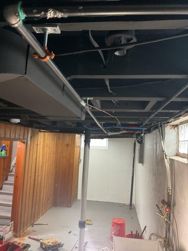 Installed gas line for dryer per approved estimate in basement location. Routed new gas piping through exposed ceiling joists using proper hangers and supports, connecting to existing gas supply system. All work completed to code specifications with pressure testing performed to ensure system integrity and safety.