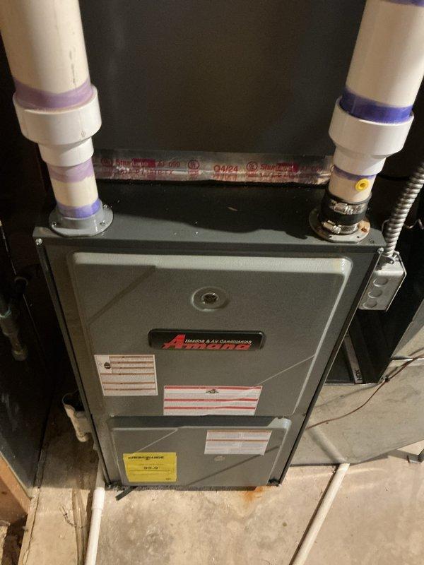Completed furnace inspection and provided replacement estimate for residential property with two HVAC units located in basement. Evaluated existing Amana furnace installed in 2009 and newer 2025 unit, documenting current operating conditions, equipment specifications, and installation configurations including PVC venting systems and ductwork arrangements. Generated comprehensive replacement options and recommendations for both heating systems to address equipment age and ensure continued reliable operation.