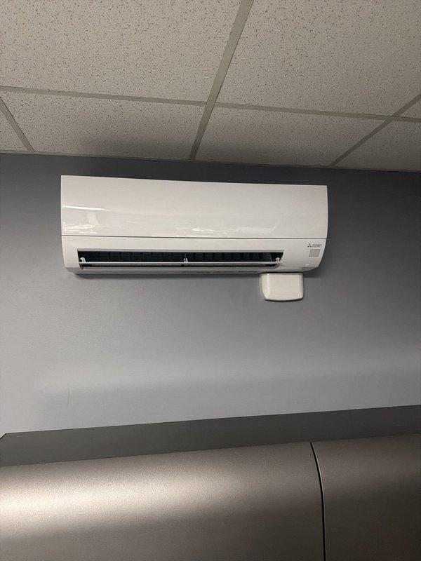 Completed mechanical and electrical installation of a 2.5-ton mini-split system in a commercial facility, including mounting the indoor wall unit and installing a new dedicated electrical circuit. Follow-up visit required to complete drain line installation.