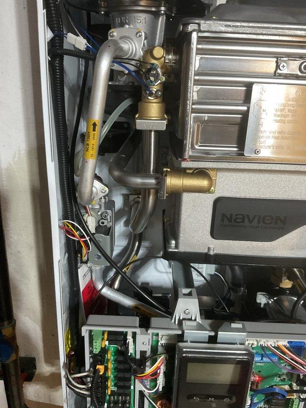 Completed installation of Navien combi boiler system with associated plumbing connections and electrical controls. Installed three circulation pumps and three thermostats to support multi-zone heating operation. Ran copper supply and return piping with proper support brackets, installed PVC venting system, and made all necessary gas line reconnections. Secured mechanical and electrical permits prior to installation. System tested and operational upon completion of two-day installation.