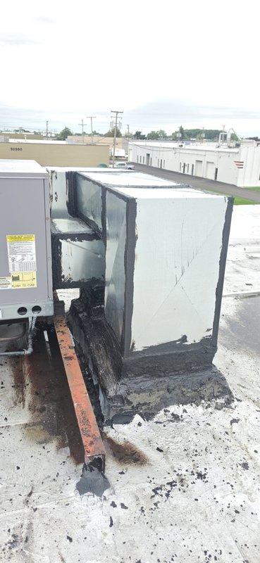 Conducted comprehensive site assessment of fire-damaged commercial rooftop HVAC unit to provide detailed ductwork and equipment replacement estimate. Unit sustained catastrophic fire damage with extensive charring, soot accumulation, warped panels, and compromised internal components rendering equipment completely non-functional. Documented extensive damage to metal casing, structural framework, and all mechanical systems through photographic evidence for insurance and replacement specifications.