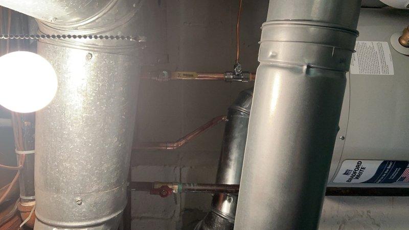 Installed a 40-gallon tanked water heater in a new building mechanical room, completing all necessary plumbing connections with copper piping and shut-off valves. Reconnected the unit to existing HVAC infrastructure and verified proper operation of all components. All installations meet code requirements with secure mounting and professional-grade connections.