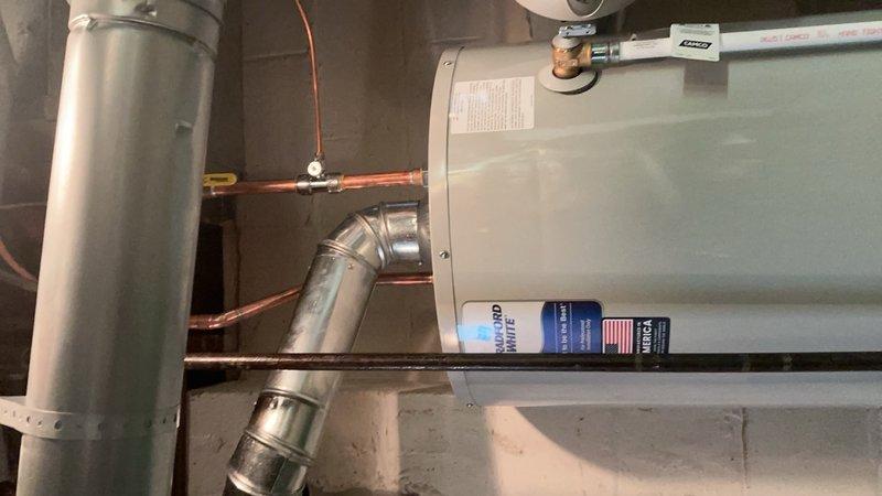 Installed a 40-gallon tanked water heater in a new building mechanical room, completing all necessary plumbing connections with copper piping and shut-off valves. Reconnected the unit to existing HVAC infrastructure and verified proper operation of all components. All installations meet code requirements with secure mounting and professional-grade connections.