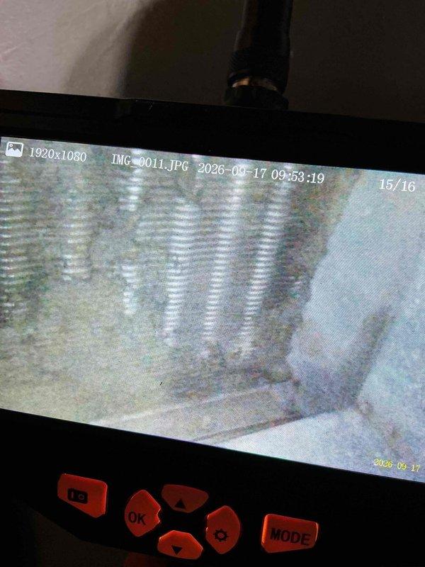 Completed comprehensive furnace tune-up and inspection on 10+ year old unit located in basement laundry room. Performed thorough visual inspection of gas valve assembly (Model VRR205H 8016), verified all electrical connections including multi-colored wiring harnesses, and confirmed proper operation of 24V control system. Conducted internal ductwork inspection using borescope camera, documenting condition of flexible duct material and interior surfaces. All safety controls tested and operational, gas valve functioning properly with no leaks detected. System showed normal wear consistent with age, with no evidence of storm-related damage observed. Furnace remains serviceable with proper maintenance and no immediate replacement necessary at this time.