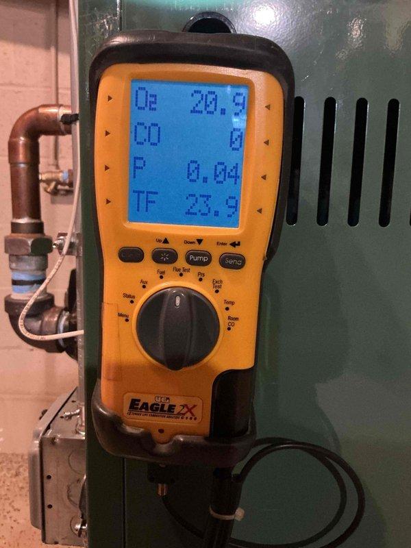 Completed comprehensive Gold boiler inspection and tune-up on 13-year-old New Yorker unit located in basement. Performed combustion analysis using digital diagnostic equipment, confirming optimal readings with O2 at 20.9%, CO at 0 ppm, and system operating within manufacturer specifications. Unit is functioning properly with no issues identified; complimentary maintenance visit completed as part of monthly service plan.