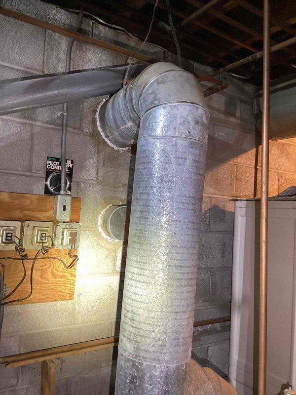Conducted on-site assessment for natural gas hot water boiler replacement serving baseboard heating system. Evaluated existing 40+ year old unit, documented electrical panel configuration, inspected ductwork and mechanical room infrastructure including condensation patterns on distribution system, and photographed current installation conditions to provide comprehensive replacement estimate for aging equipment.