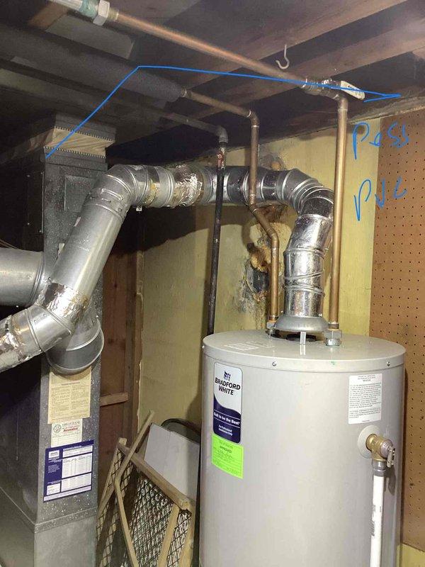 Completed furnace inspection on 20-year-old unit located in basement and identified cracked heat exchanger requiring system replacement. Provided comprehensive estimate for new HVAC equipment installation including furnace replacement, proper venting, and ductwork connections. Documented existing system configuration with photographs showing current furnace, water heater, metallic ductwork, and associated plumbing components to support replacement recommendations.