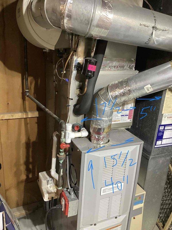 Completed furnace inspection on 20-year-old unit located in basement and identified cracked heat exchanger requiring system replacement. Provided comprehensive estimate for new HVAC equipment installation including furnace replacement, proper venting, and ductwork connections. Documented existing system configuration with photographs showing current furnace, water heater, metallic ductwork, and associated plumbing components to support replacement recommendations.