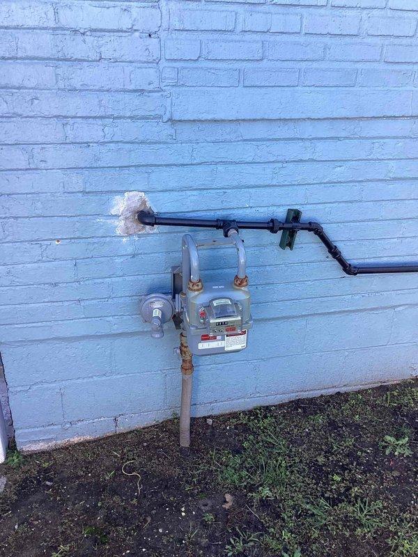 Conducted on-site evaluation for whole home generator installation at residential property. Assessed exterior wall mounting location on light blue brick structure and documented existing natural gas meter installation with current piping configuration. Evaluated gas service capacity, meter accessibility, and proposed generator placement area marked on ground near exterior wall. Reviewed electrical service panel requirements and determined optimal routing for gas line connection from existing meter to proposed generator location. Documented site conditions including ground surface preparation needs and clearance requirements from structure and property boundaries. Provided comprehensive electrical estimate for new whole home generator system installation including all necessary materials, labor, permits, and connection to existing natural gas infrastructure.