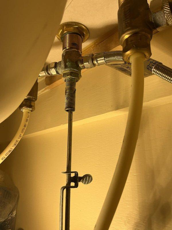 Responded to priority service call for leaking upstairs bathroom sink. Upon arrival, performed thorough inspection of sink plumbing assembly, including supply lines, drain connections, and trap configuration. Examined braided metal supply hoses, threaded pipe fittings, and compression connections for signs of water intrusion. Inspected white PVC P-trap assembly and drain stopper mechanism for proper sealing and alignment. Documented existing plumbing conditions with detailed photographs showing underside cabinet installation, including chrome faucet supply lines, drain flange assembly, and all connection points. Identified source of leak and completed necessary repairs to restore proper function and eliminate water seepage. Tested all connections under pressure to verify leak resolution and ensure system integrity.