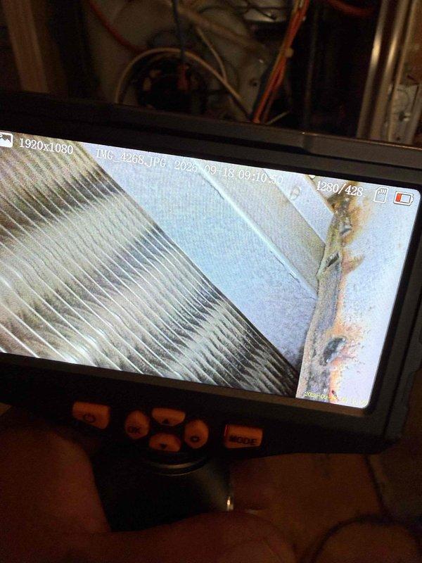 Completed comprehensive Gold Furnace Inspection on 10+ year old unit located in basement. Performed thorough visual inspection of heat exchanger using digital inspection camera, confirming no cracks or deterioration in metallic fins. Verified flue gas temperature at 238.8°F using calibrated digital thermometer, which falls within normal operating parameters. Inspected evaporator coil and observed minor discoloration but no significant buildup requiring immediate attention. Examined ductwork connections and fasteners for proper sealing. All system components found to be functioning properly with no safety concerns identified. Unit operating as designed with no service recommendations required at this time.
