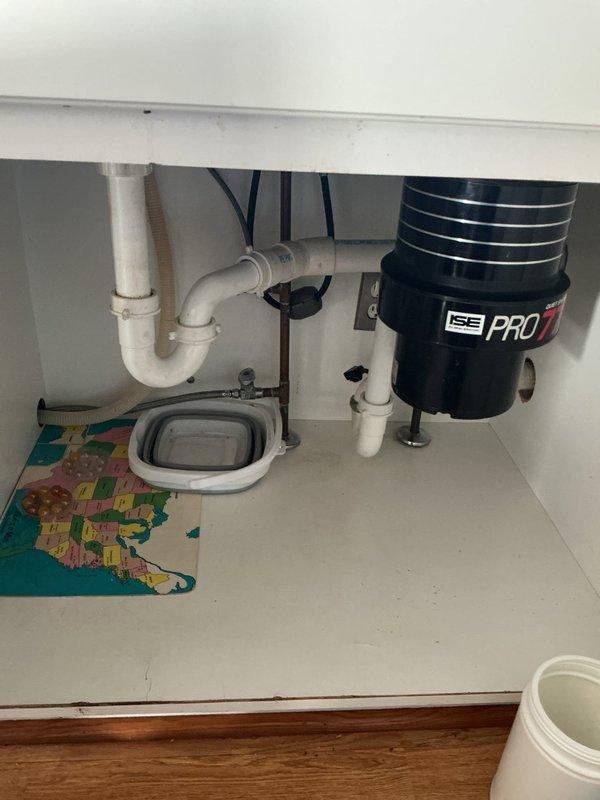 Responded to follow-up complaint regarding potentially reversed hot and cold water supply lines on previously installed kitchen faucet. Inspected under-sink plumbing connections and verified proper configuration of supply lines to ensure correct water temperature delivery at fixture. Additionally, completed installation of customer-supplied 4-inch spread bathroom faucet, including connecting supply lines through tiled wall penetrations and securing mounting hardware. Both faucets tested and verified operational with proper water flow and temperature control.