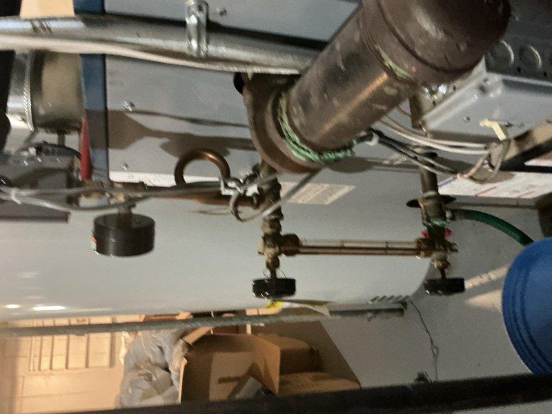 Completed comprehensive Gold-level maintenance inspection on 10-year-old residential boiler system located in basement. Performed thorough visual inspection of boiler unit, verified proper operation of all safety controls and valves, examined copper piping connections and brass fittings for leaks or corrosion, and inspected associated HVAC ductwork and ventilation components. Checked condensate drain system functionality, confirmed secure mounting of all piping and ductwork, and documented equipment condition through photographic documentation. All systems operating within normal parameters with no immediate concerns identified.