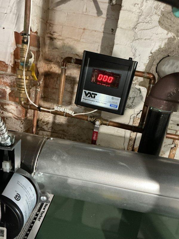 Completed comprehensive Gold Boiler Inspection on 13-year-old steam boiler system located in basement. Performed visual inspection of all major components including sight glass with sediment accumulation, pressure gauge reading 0 psi, expansion tank, copper piping network, and digital control unit displaying operational code 004. Verified system operational status, examined all connections, fittings, and mounting hardware, and documented equipment condition through photographic records for maintenance history.