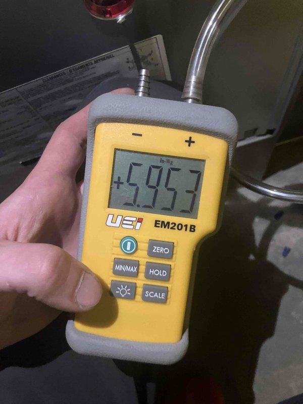 Completed comprehensive Gold Furnace Inspection on 1-year-old unit with no operational issues reported. Performed complete system tune-up including pressure diagnostics using calibrated digital manometer, measuring draft pressure at -595.3 In-Wc to verify proper combustion air flow and venting performance. Inspected integrated Honeywell Home humidification system, verifying proper mounting, water supply connections via PVC piping, and drainage configuration. Evaluated all ductwork connections, copper refrigerant lines, and electrical controls for proper installation and operation. System operating within manufacturer specifications with no deficiencies noted.