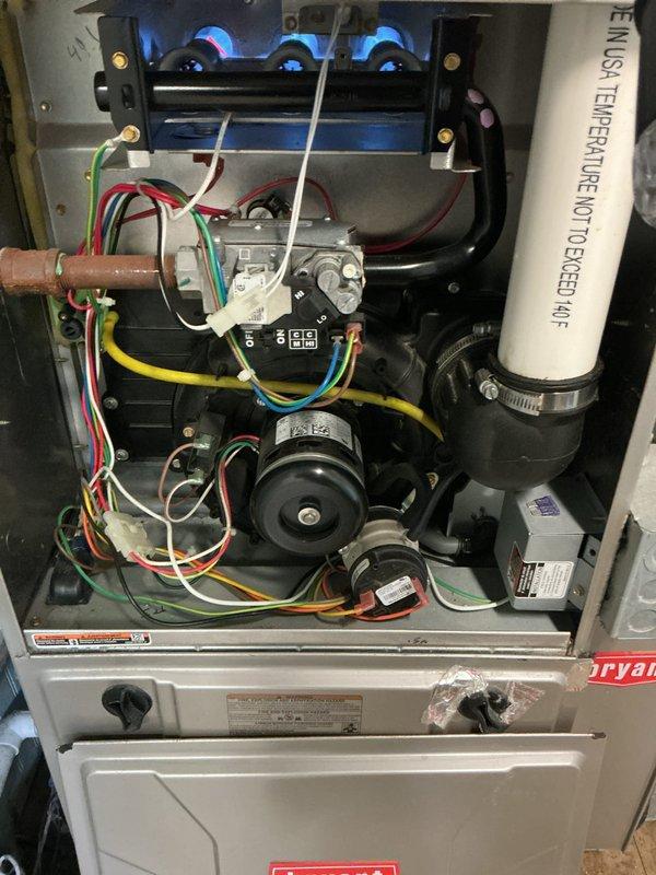 Completed Gold Furnace Inspection on a 10-year-old Bryant forced air furnace located in the basement. Verified unit operational status with burner assembly firing properly, displaying healthy blue flames indicating proper combustion. Inspected and documented air filter condition, blower motor assembly, gas valve connections, electrical wiring, flame sensor, and Category IV exhaust venting system. All components found to be functioning within normal parameters with no immediate service needs identified.
