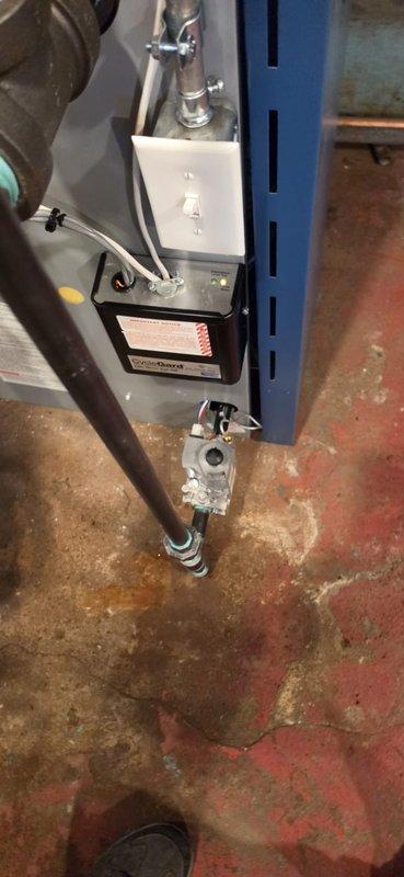 Completed boiler installation in basement mechanical room, including all necessary piping connections and system integration with existing infrastructure. Mechanical and electrical permits were requested and approved for the installation. Connected new blue-cased boiler unit to copper and metal piping network, ensuring proper gas line routing and secure mounting. System was tested and reconnected to verify operational functionality upon completion.