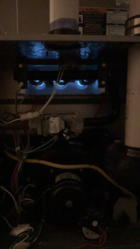 Completed comprehensive furnace tune-up and safety inspection on 12-year-old unit located in basement. Performed full system evaluation including burner operation, flame sensor cleaning, heat exchanger inspection, blower motor lubrication, and electrical control testing. Verified proper ignition sequence with visual confirmation of blue flame pattern across all burners, checked all wire connections and control board functionality, tested capacitor values, and confirmed safe operation of all safety devices and limit switches.