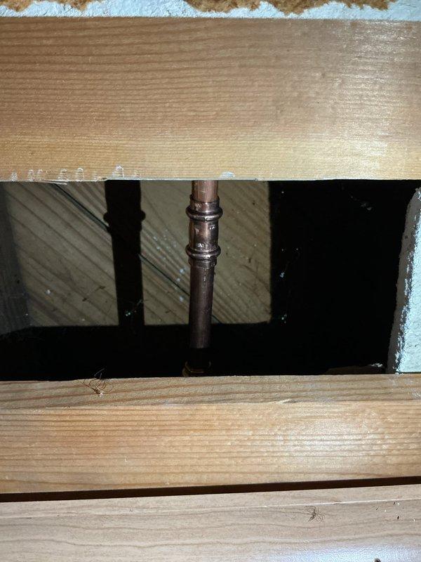 Replaced two exterior hose bibs with frost-free units, accessing one through ceiling opening in front of house and the second located under deck. Installed new waterline through back bedroom wall with shut-off valve added under kitchen sink. Attempted to adapt existing waterline to outdated pedestal sink but determined sink incompatibility requires replacement with new pedestal-style fixture on return visit.
