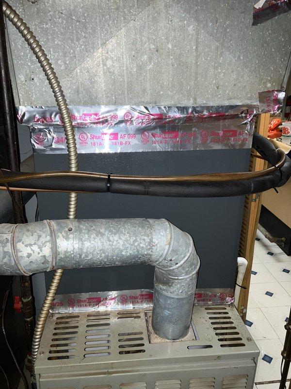 Conducted complimentary estimate for replacement of 30-year-old natural gas furnace located in basement. Evaluated existing HVAC system including ductwork, electrical connections, refrigerant lines, and air handler configuration. Documented current equipment condition through photographs showing aged galvanized ductwork, metallic flex conduit, copper tubing, and existing furnace unit with associated mechanical connections. Provided replacement recommendations based on system assessment.