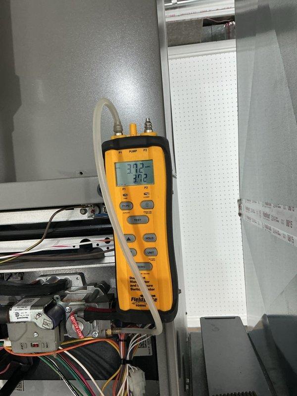 Completed annual Gold-level furnace maintenance on 11-year-old unit located in basement. Performed comprehensive tune-up including inspection of blower assembly, motor, gas valve, flame sensor, and all electrical connections. Verified proper combustion readings and system operation using digital combustion analyzer, confirming temperature rise within manufacturer specifications at 37.2°F and 30.2°F differential readings. All components functioning properly with no deficiencies noted.