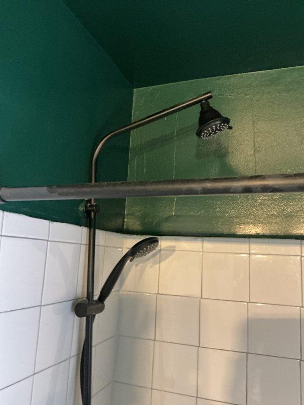 Completed installation of new handheld shower assembly with slide bar and flexible hose in bathtub/shower enclosure. Replaced bathroom sink fixture as requested by homeowner. All fixtures tested for proper water flow and verified leak-free operation upon completion.