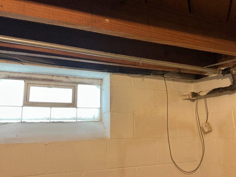 Responded to report of gas leak in basement area. Upon inspection, identified small leak at galvanized steel pipe joint. Temporarily secured affected joint with repair tape as interim safety measure. Performed pressure test to verify leak location and assess system integrity. Recommended permanent repair or replacement of aging galvanized gas piping due to visible oxidation and deterioration of existing infrastructure.
