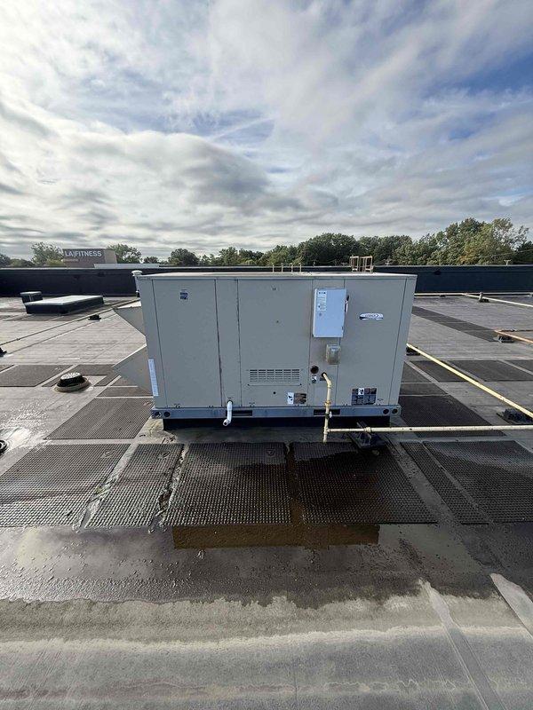 Performed scheduled filter change on commercial rooftop unit (RTU). Accessed roof-mounted packaged HVAC system and removed four heavily soiled pleated air filters showing significant dust accumulation and discoloration. Installed new replacement filters to restore proper airflow and system efficiency. Unit operational upon completion of service.