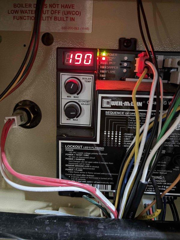 Completed annual heating maintenance and tune-up on an 8-year-old Weil-McLain boiler system. System was found operating properly with boiler temperature reading 190°F on digital display, all indicator lights functioning correctly including power, relay, and flame status LEDs. Inspected and documented pressure reducing valve, copper piping connections, and control panel components; noted existing copper oxidation on piping but no immediate service concerns. Customer renewed maintenance membership to cover this appointment.