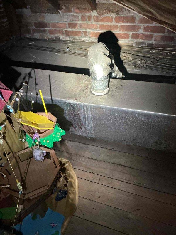 Responded to service call for water leakage from air handler unit installed in 2021 and located in attic. Upon inspection, discovered significant condensation accumulation on supply ductwork due to inadequate insulation. Identified moisture droplets forming on metal duct surfaces, which was causing water to drip onto attic floor. Inspected air handler unit for proper drain line function and confirmed primary and secondary drain lines were clear and operating correctly. Determined the water leakage issue was solely related to duct condensation rather than equipment malfunction. Recommended adding or upgrading duct insulation to prevent future condensation and moisture problems in the unconditioned attic space.