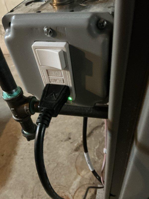 Responded to service call for reported furnace leak in basement. Upon inspection, identified condensate drainage issue originating from the furnace condensate pump assembly. The condensate pump, which removes water produced during the heating cycle, showed signs of improper drainage with visible water staining on the concrete floor beneath the unit. Examined the pump housing, discharge tubing connections, and electrical components including the float switch with LED indicator. Verified pump operation and checked all connection points for secure fittings and proper seal. Addressed the leak source and ensured condensate system was functioning correctly to prevent future water accumulation. System tested and confirmed operational with no active leaking observed at time of service completion.