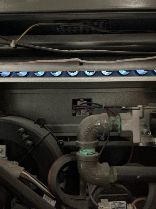 Completed routine tune-up and inspection on two 5-year-old gas furnace units located in basement. Performed visual inspection of burner assemblies on both units, confirmed proper ignition sequence and verified blue flame pattern indicating complete combustion. Inspected gas valve assemblies, heat exchanger components, flame sensors, and electrical connections for proper operation. All burners firing uniformly with no abnormalities detected. Both furnace units operating within normal parameters with no immediate service needs identified.