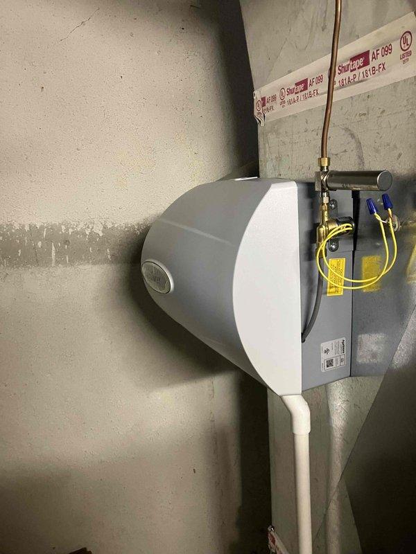 Completed comprehensive fall tune-up and inspection on recently installed Carrier furnace system located in basement utility area. Performed thorough cleaning of all components, verified proper operation of burner assembly, heat exchanger, blower motor, and gas valve connections. Inspected and documented all system components including water treatment equipment and associated plumbing connections, confirmed proper drainage through PVC discharge lines, and verified all safety controls and warning labels are intact and functioning correctly.