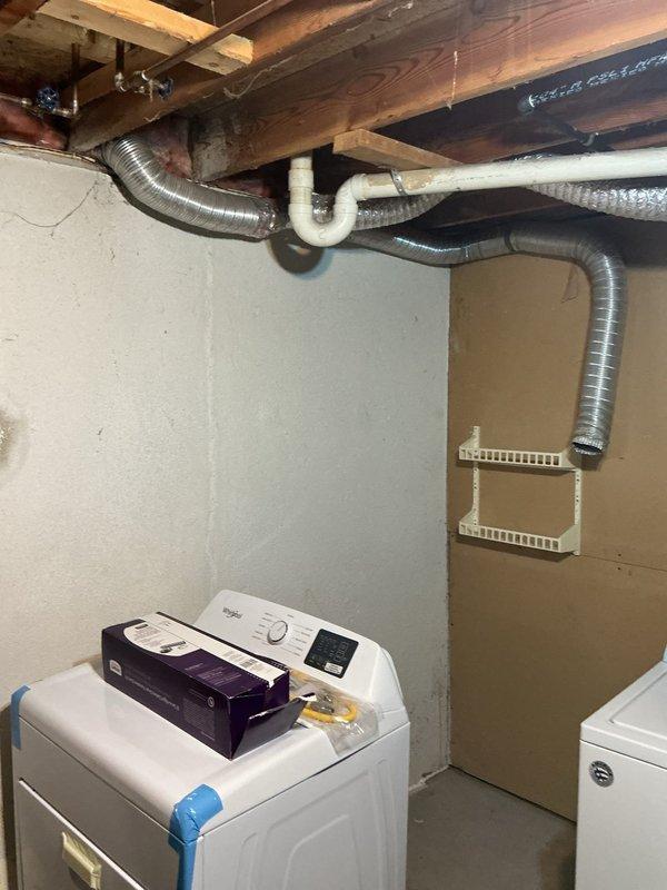 Provided comprehensive estimate for installation of rigid metal dryer vent piping system in basement utility area. Assessed existing laundry room configuration with washing machine and dryer setup, evaluated current flexible aluminum ductwork routing along exposed ceiling joists, and determined optimal pathway for code-compliant rigid metal vent tubing. Inspection revealed existing flexible duct connection requiring replacement with rigid metal piping to improve airflow efficiency, reduce lint accumulation, and meet current building standards for dryer exhaust systems.