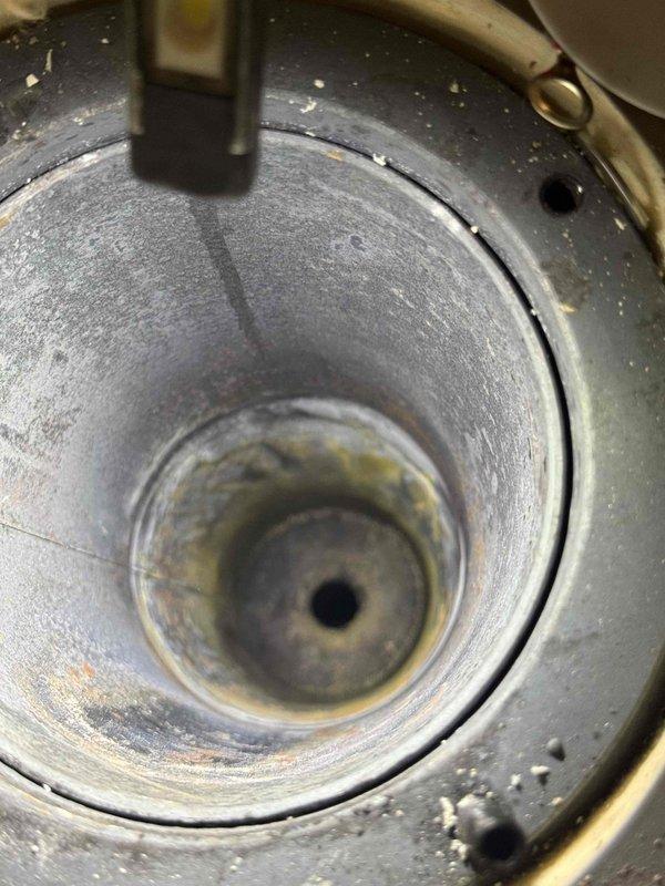 Responded to return visit for 50-gallon power vent water heater with complete failure. Inspected flame sensor rod and burner assembly, documenting conditions with photos showing sensor positioning and combustion chamber interior. Awaiting arrival of replacement flame sensor rod currently on order from supply house for installation to restore unit operation.