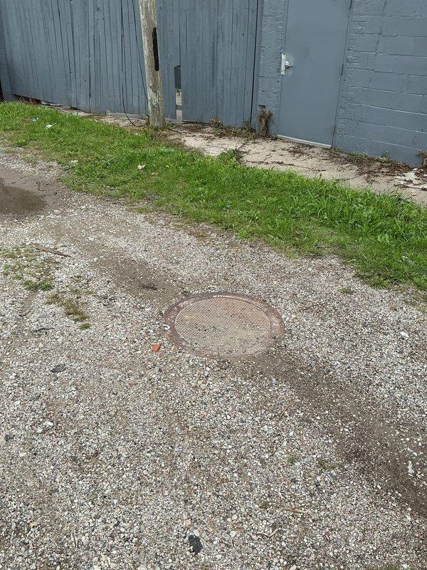 Responded to main drain blockage with cable retrieval and video inspection services. Upon arrival, accessed main sewer line through exterior cleanout access point visible in gravel surface area near structure. Successfully extracted previously lodged drain snake that had become stuck in the line during prior clearing attempt. Performed comprehensive camera inspection of main drain line to assess condition and verify complete removal of obstruction. Video documentation revealed no remaining foreign objects or significant line damage. Inspected interior plumbing connections and drainage system through bathroom access point, confirming proper flow restoration throughout the system. All extracted equipment and debris removed from property, cleanout secured, and drainage system returned to full operational status.