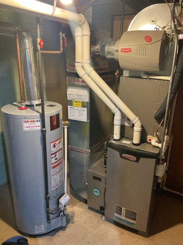 Completed Gold Furnace Inspection and tune-up on 3-year-old Lennox heating system in basement. Performed comprehensive cleaning and winter preparation service on furnace with no reported issues or symptoms. Inspected PureAir purification system and confirmed UV bulb replacement needed, with part already ordered from Lennox and scheduled for delivery to warehouse. Verified Lennox thermostat operation showing proper temperature control at 71°F current temperature with heating setpoint at 66°F. Inspected Bryant humidifier mounted on furnace and verified proper installation of white PVC vent piping. System operating within normal parameters and ready for heating season.