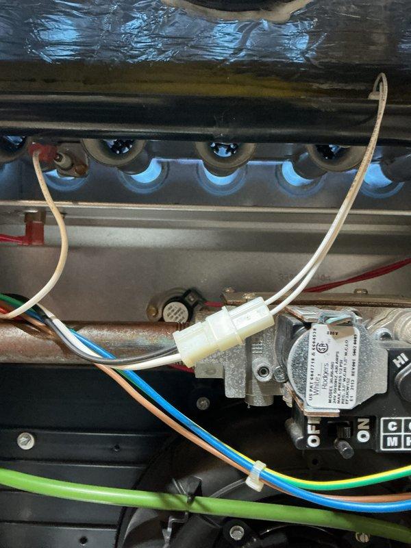 Completed comprehensive Gold Plan furnace inspection on 5-year-old forced air heating system located in basement. Performed full system diagnostics including combustion analysis testing to verify proper air-fuel mixture ratios, flue gas temperature readings, and carbon monoxide levels within manufacturer specifications. Inspected heat exchanger assembly with four burner tubes, confirmed ceramic igniters and flame sensors operational, and examined all electrical connections including gas valve wiring and control board terminals. Verified proper operation of all safety controls, checked blower motor assembly, and documented system performance metrics using calibrated combustion analyzer equipment. All components found to be functioning within normal operating parameters with no immediate service needs identified. System operating safely and efficiently.