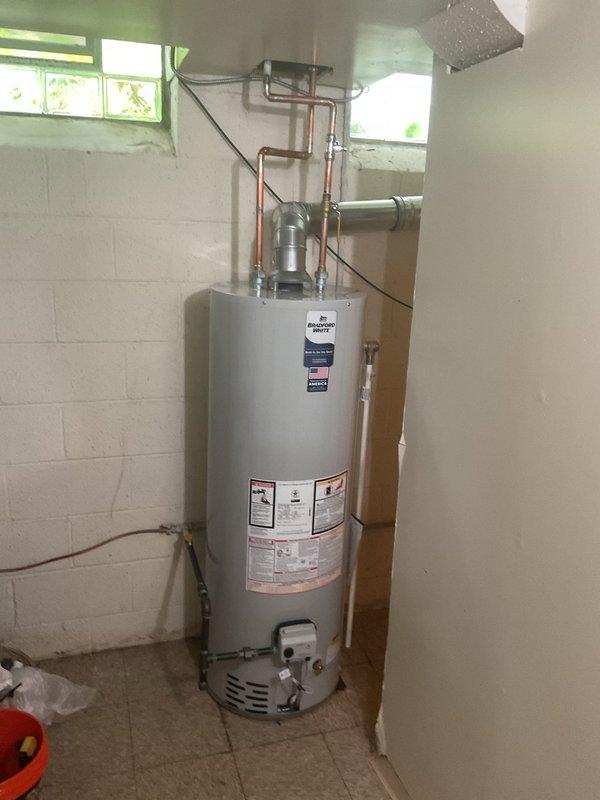 Completed full HVAC system installation including a 90,000 BTU high-efficiency furnace, 3-ton air conditioning unit with rear placement, and programmable thermostat. Installed 40-gallon water heater with proper venting and pressure relief valve configuration, connected all copper supply lines and drainage systems. Added whole-home humidifier to furnace system for improved indoor air quality. Performed complete system flush and reconnected all electrical components to code. Installed condensate pump with 5x35 configuration for proper drainage management. All mechanical, electrical, and plumbing permits were secured prior to installation. System tested and verified operational, with utility rebate documentation completed for energy-efficient equipment.