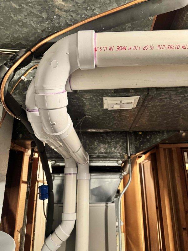 Completed installation of a 90,000 BTU Lennox high-efficiency furnace replacement in basement mechanical room. Installed new white PVC venting system with proper pitch and support, configured 20x25x4 filter rack, and integrated humidifier pad into existing ductwork. All work performed to code specifications with mechanical permit obtained, system tested and operational, qualifying for utility rebate program.