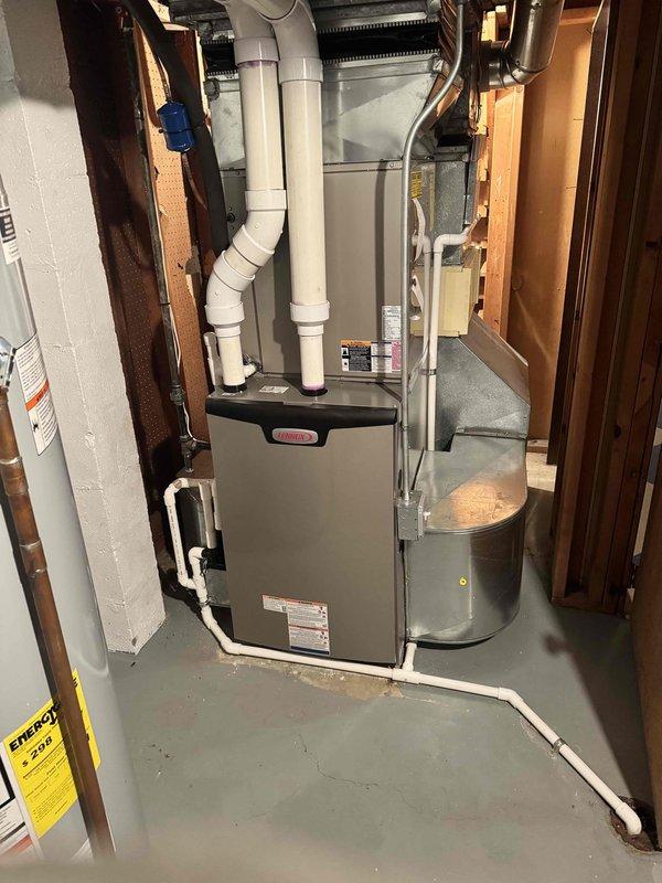 Completed installation of a 90,000 BTU Lennox high-efficiency furnace replacement in basement mechanical room. Installed new white PVC venting system with proper pitch and support, configured 20x25x4 filter rack, and integrated humidifier pad into existing ductwork. All work performed to code specifications with mechanical permit obtained, system tested and operational, qualifying for utility rebate program.
