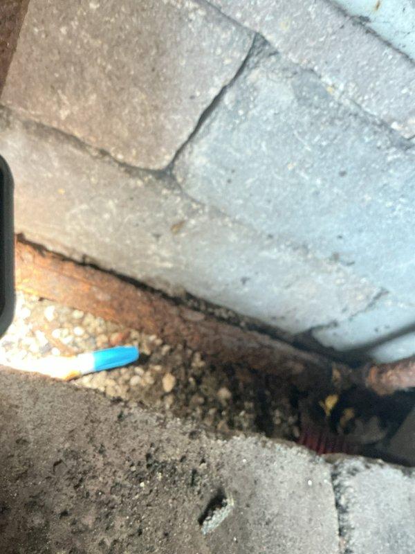 Completed gas line replacement in basement/foundation area of residential property. Removed deteriorated existing gas piping and installed new code-compliant gas line through crawl space with exposed brick archway ceiling and concrete block foundation walls. Secured new piping with proper mounting brackets and ensured all connections meet current safety standards and local building codes.